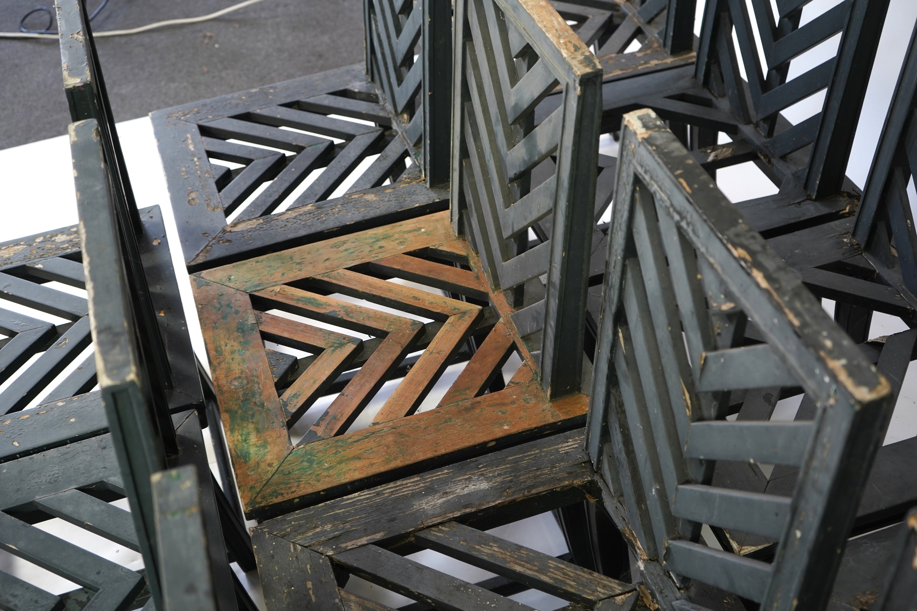 A set of fourteen green painted beech garden chairs, designed by Emilio Terry for the Theatre de Verdue, Chateau De Groussay